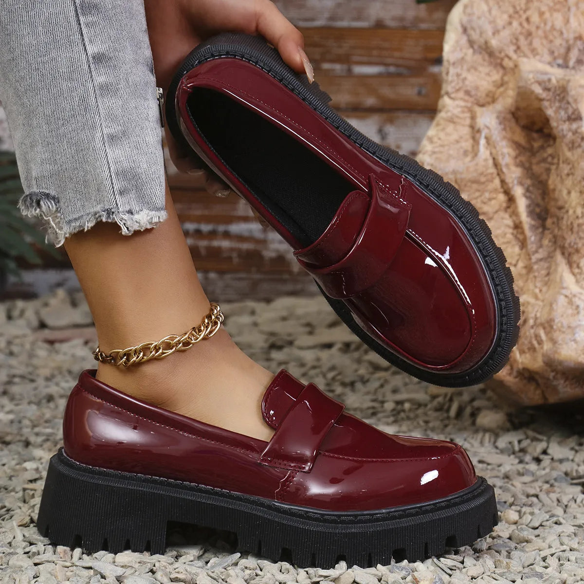 Plus size slip-on loafers with chunky heel in black, green, and wine red colours on a solid background
