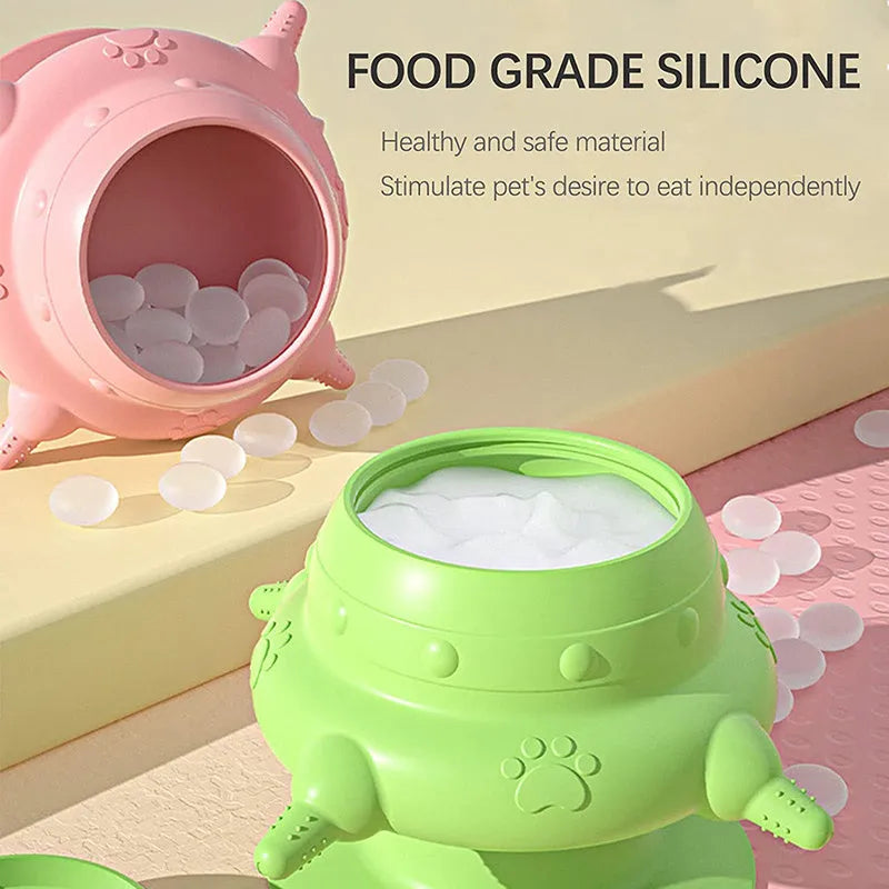 Pink silicone pet milk feeder with pacifier on a flat base, for puppies and kittens.