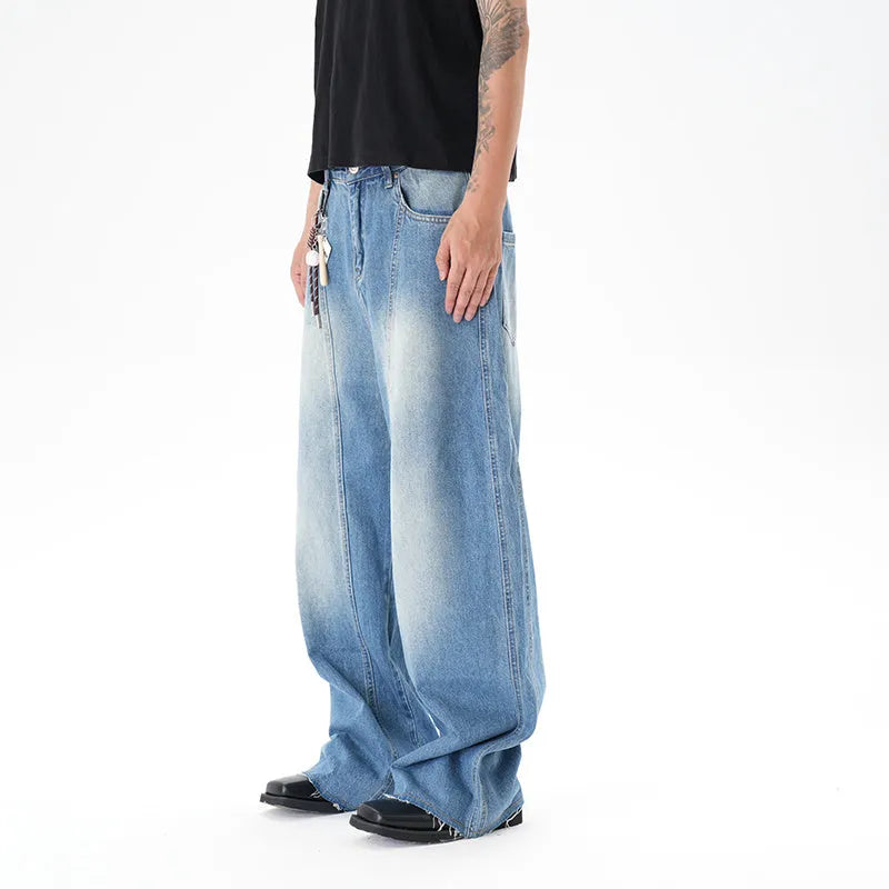 Light blue vintage washed wide leg denim jeans with a zipper fly on a mannequin.