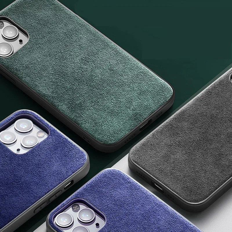 A luxury suede iPhone back cover in dark blue, shown fitted on a smartphone.