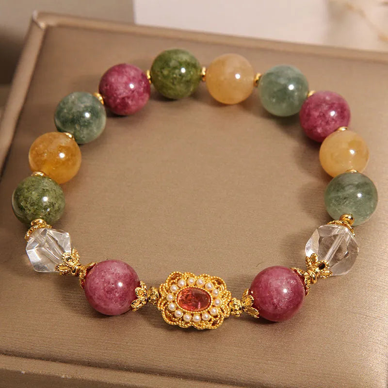 Jade colour tourmaline bracelet for women with alloy setting and rhinestone details on pearl crystal base.