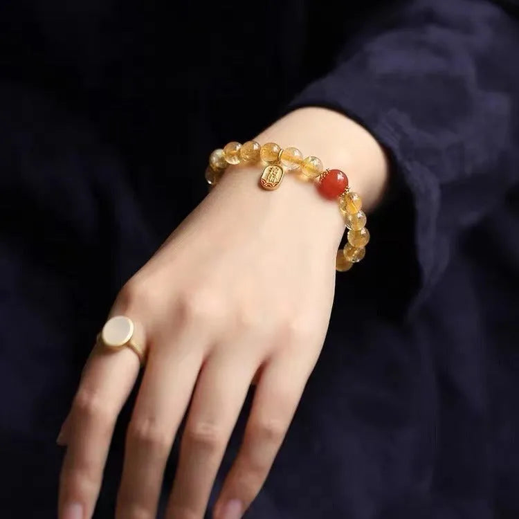 Polished red agate bead bracelet on gold-plated chain, showing bead size options of 6mm, 8mm and 10mm.