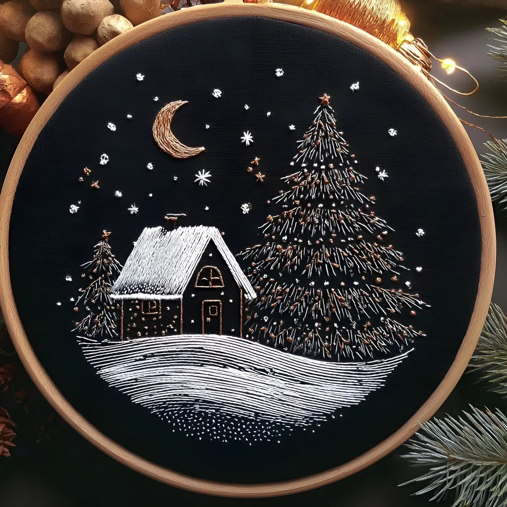 Christmas snow house embroidery kit showing 28cm square cotton linen fabric with printed landscape pattern.