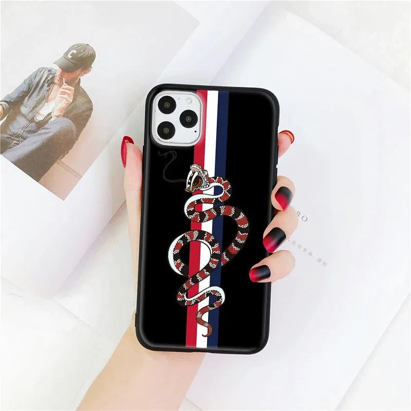 Soft silicone iPhone case with frosted surface showing detailed snake cartoon pattern in black colour