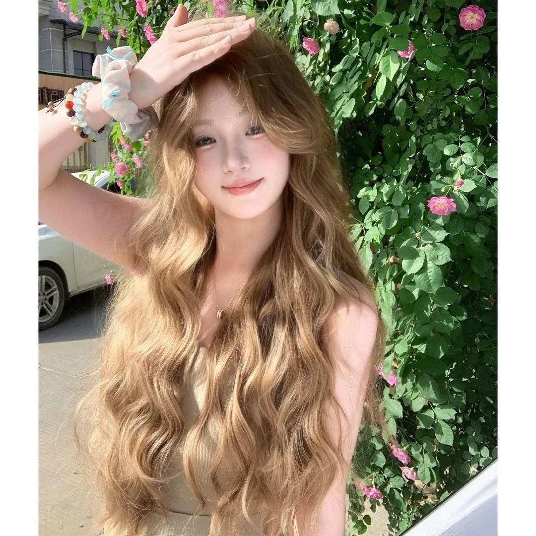 Medium size long curly wig in linen colour made from high temperature synthetic fibre.
