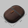 Black pet hair remover glove with soft silicone bristles on a hand, showing the dual-sided design.