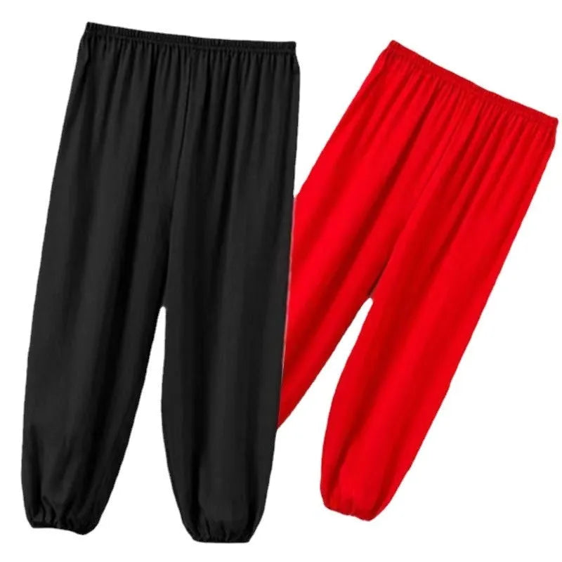 Black children's high-elasticity Lycra practice pants for Sanda martial arts training on a white background.