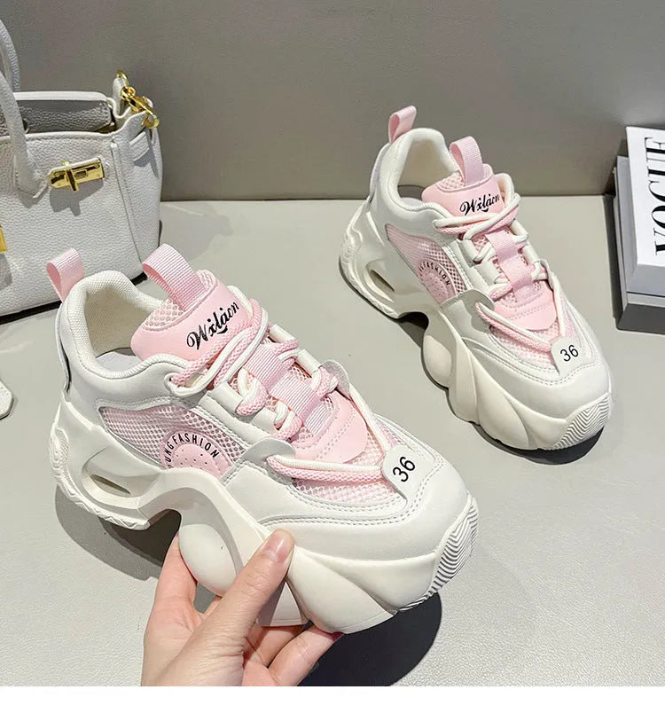 Women's pink sneakers with cross straps, 3-5cm thick sole, and mesh lining for breathable comfort
