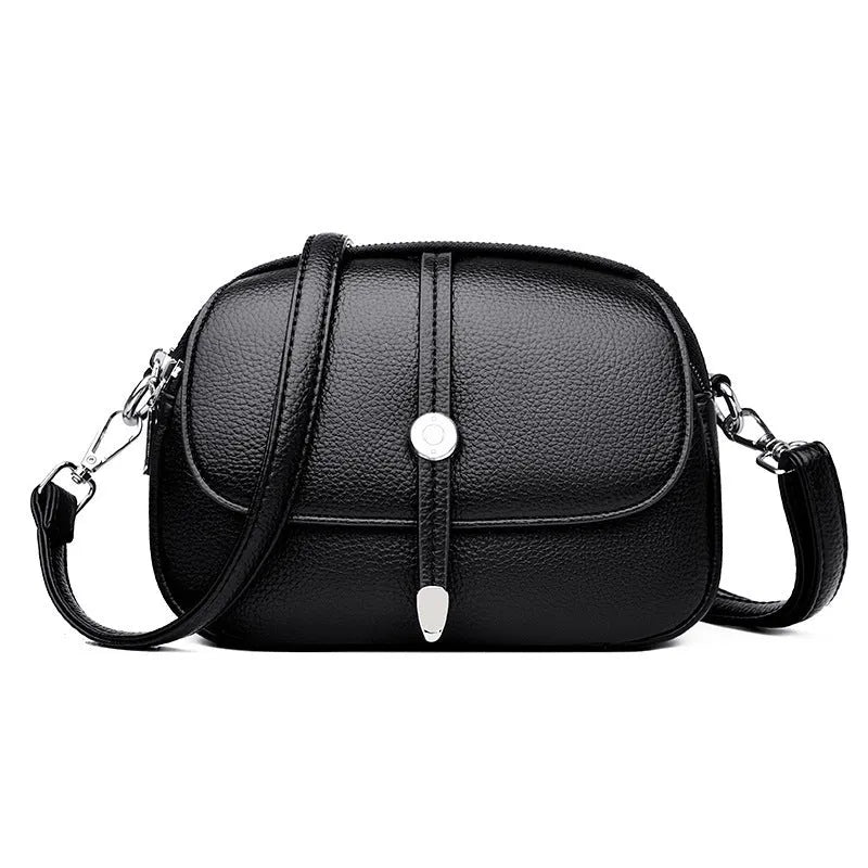 Women's soft PU oval crossbody shoulder bag with sewing thread detailing in dark brown