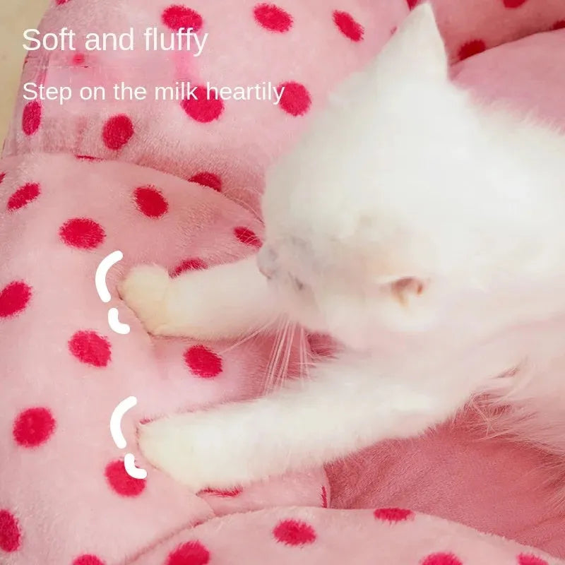 Pink dot pattern fabric cat bed shown in two circular sizes, 45cm and 65cm diameter.