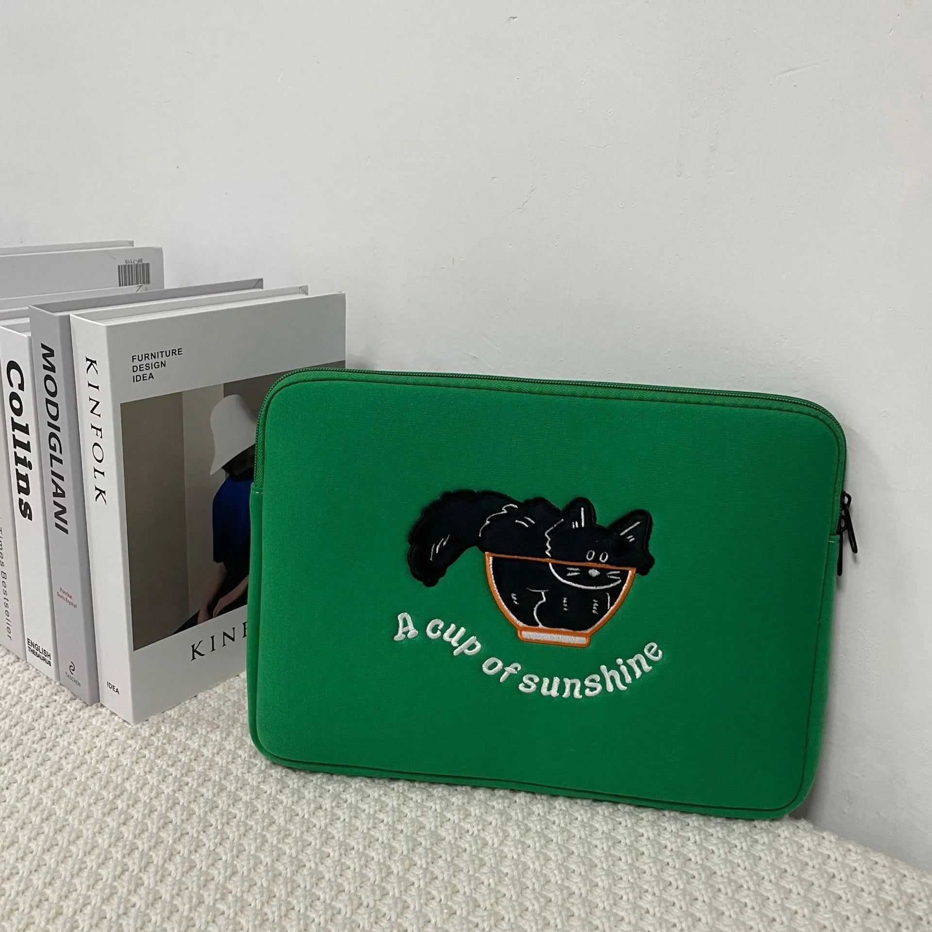 Embroidered animal design laptop sleeve in polyester, showing size options for 13, 14 and 15.6 inch laptops.