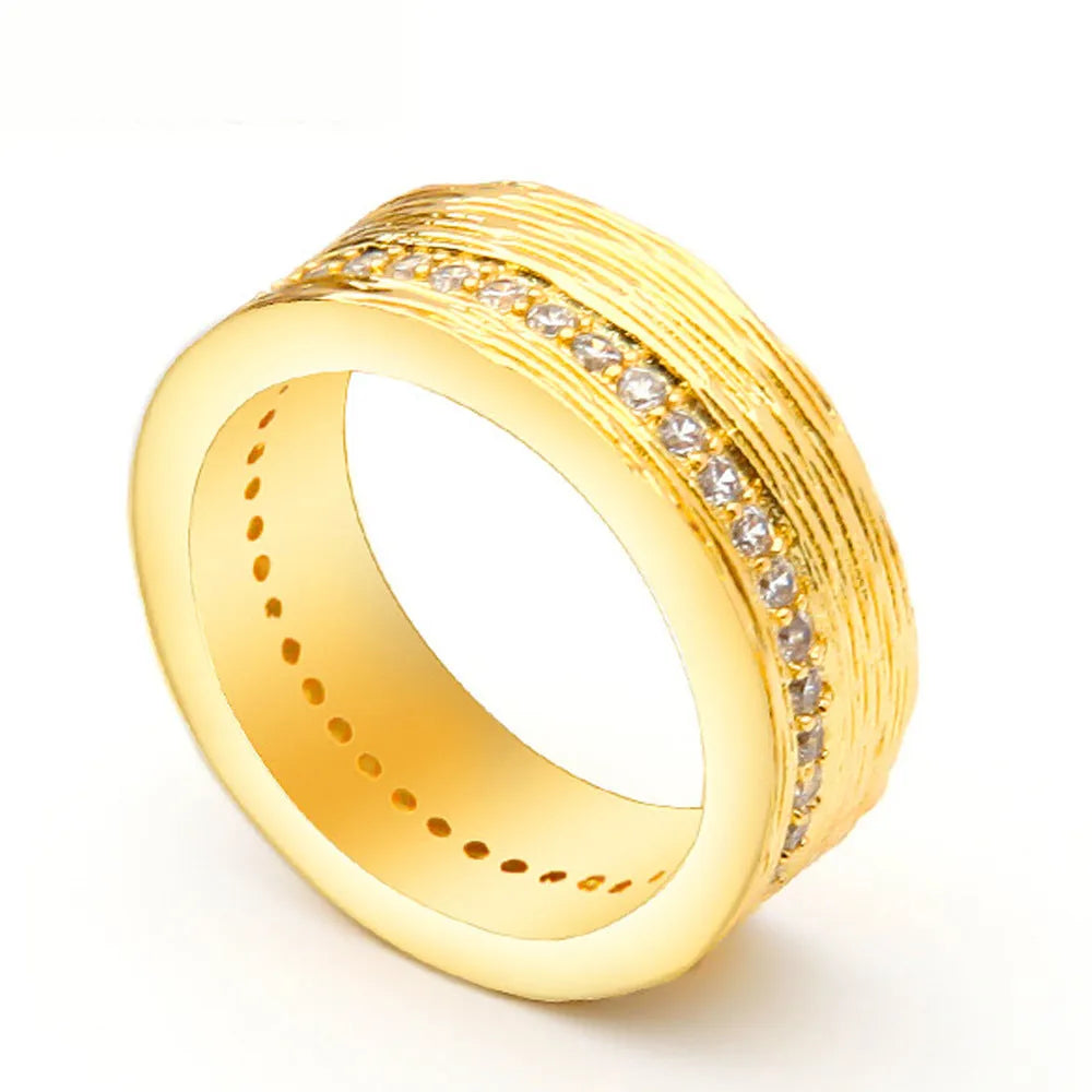 Gold geometric women's ring with zircon stone, showing clean lines and symmetrical design on hand