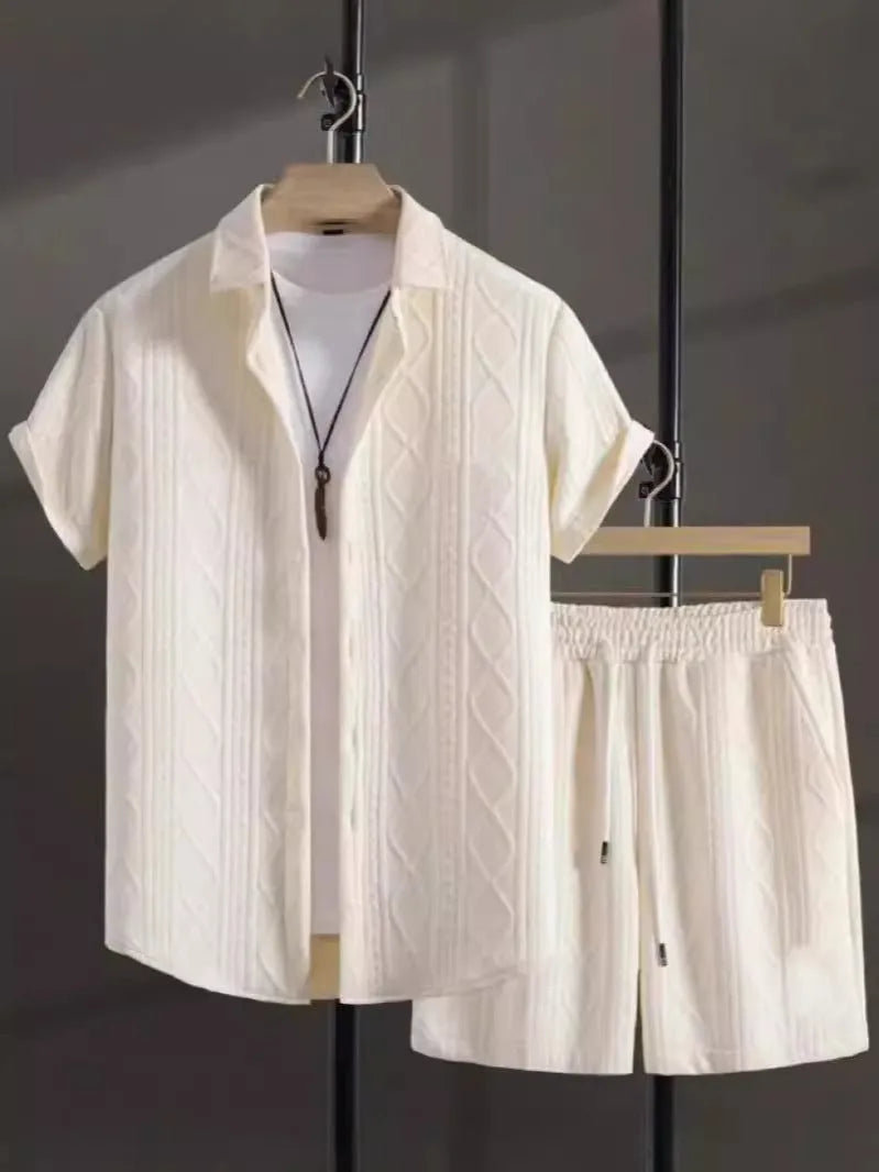 Man wearing a beige jacquard short sleeve suit jacket and matching shorts on a summer day.