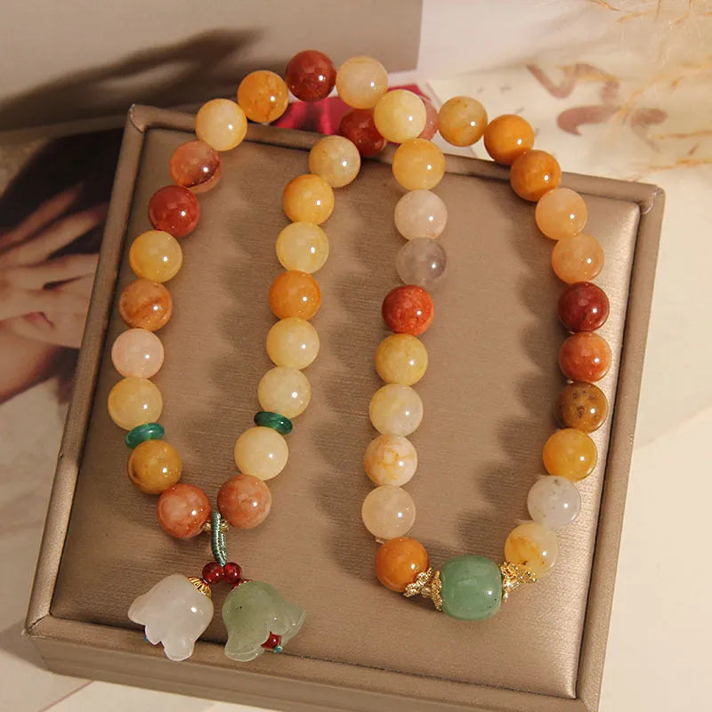 Natural jinsi jade multi-layer bracelet for women showing adjustable knotted design with orchid pendant detail
