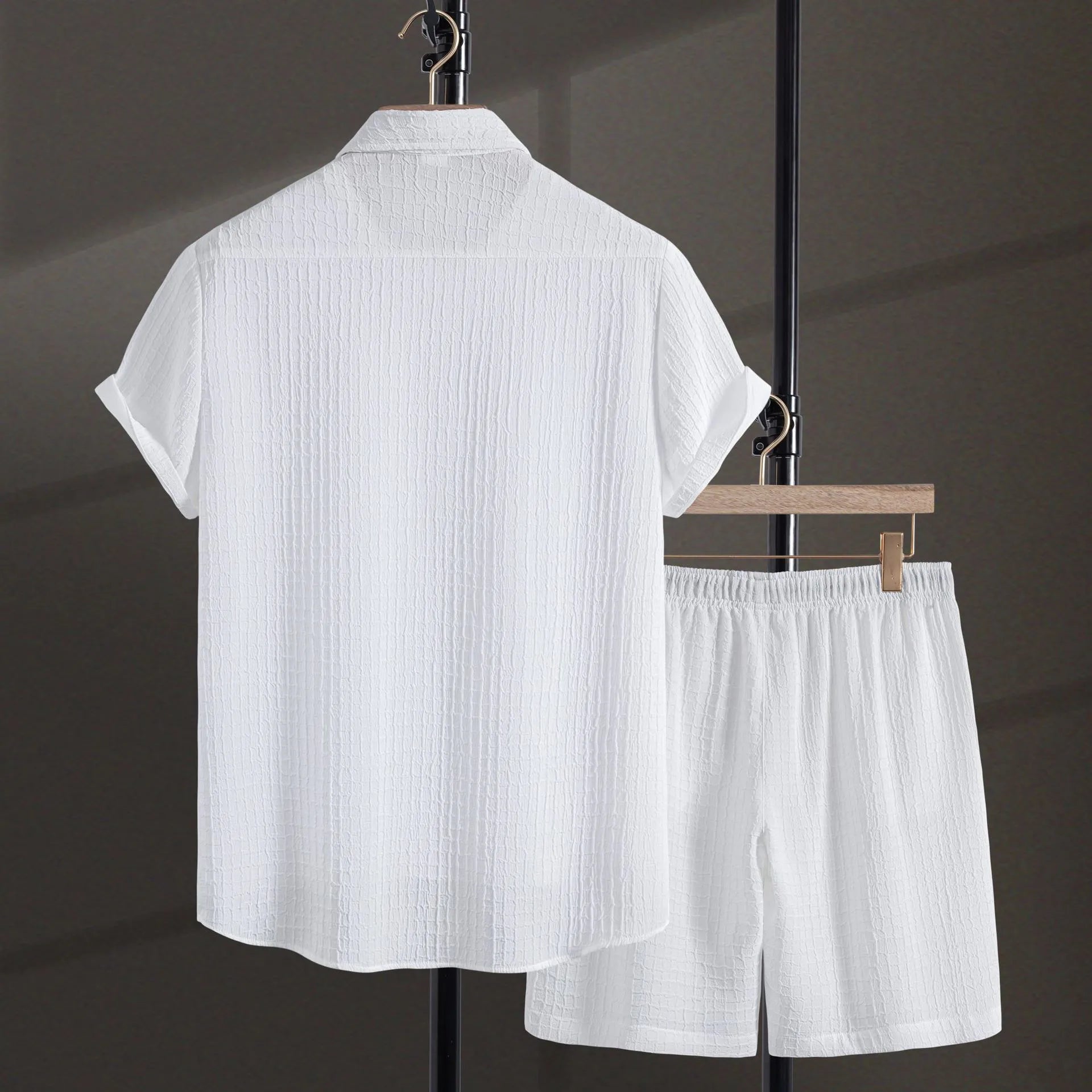 Men's white cotton blend jacquard shirt and matching shorts casual suit set laid flat.