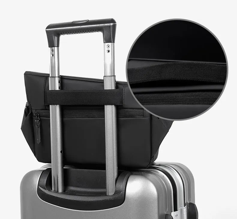 Men's grey crossbody bag with motorcycle sling strap, horizontal square shape, and zipper opening