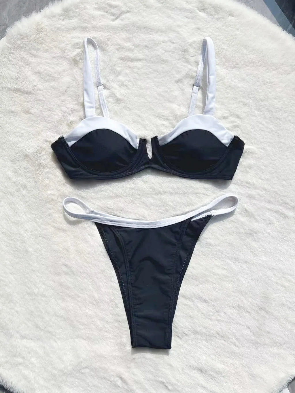 Black women's low waist bikini swimsuit with stitching split detail on brief style