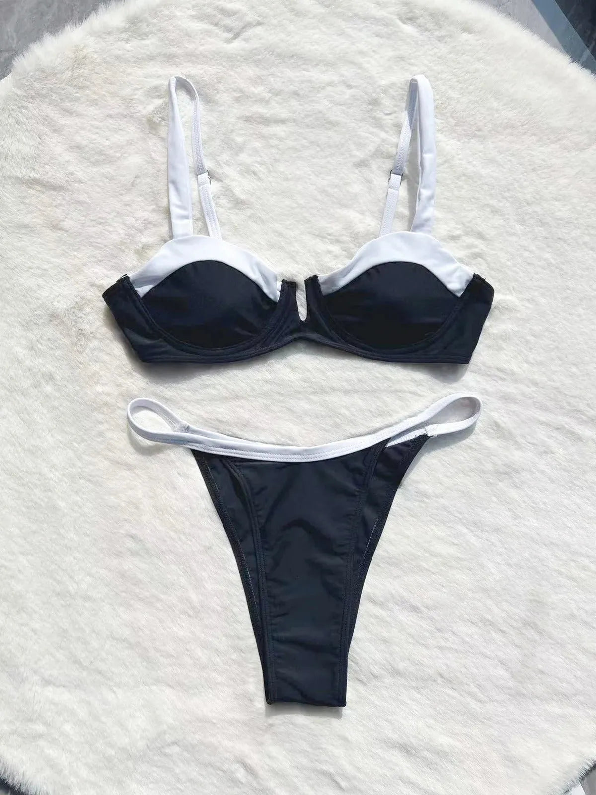 Black women's low waist bikini swimsuit with stitching split detail on brief style