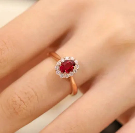Women's sterling silver ring with gold pigeon blood ruby gemstone and floral pattern design