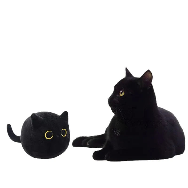 Fluffy black cat plush toy with soft texture, shown as a decorative cushion