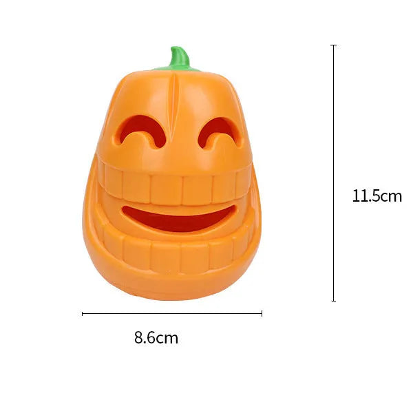 Orange Halloween pumpkin-shaped dog toy with textured surface and treat-dispensing funnel opening