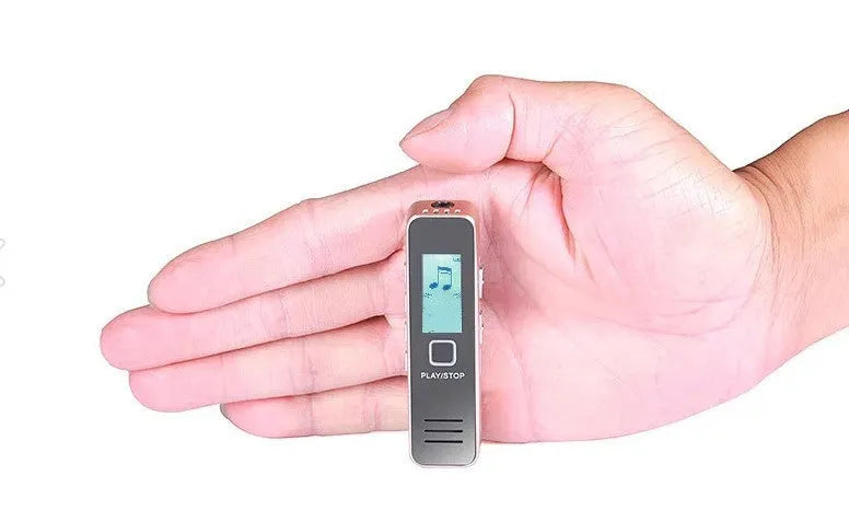 Small black or gold plastic voice recorder with display and microphone.