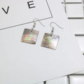 Women's geometric shell earrings in square and rectangular designs with natural shell material texture