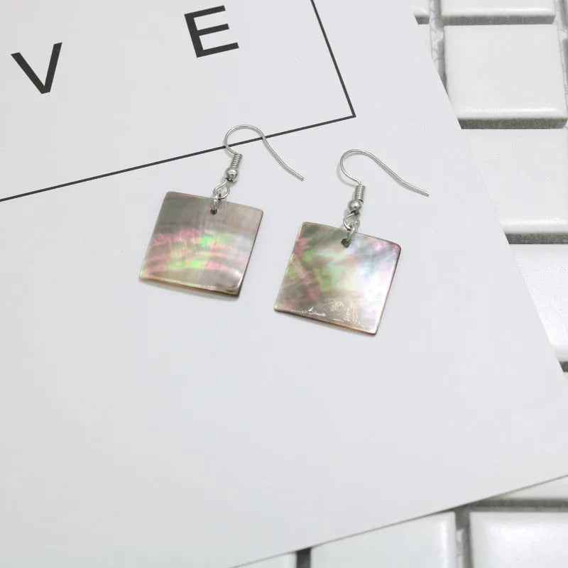 Women's geometric shell earrings in square and rectangular designs with natural shell material texture