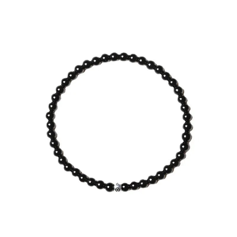 Geometric agate bracelet with round and square beads in obsidian, blue San, and black agate, 4mm size.