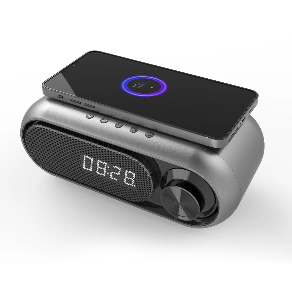 Space grey wireless charging alarm clock with Bluetooth speaker and LED display.