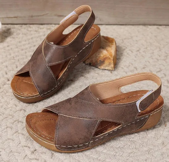 Women's brown Roman platform sandals with an ankle skirt and Velcro strap