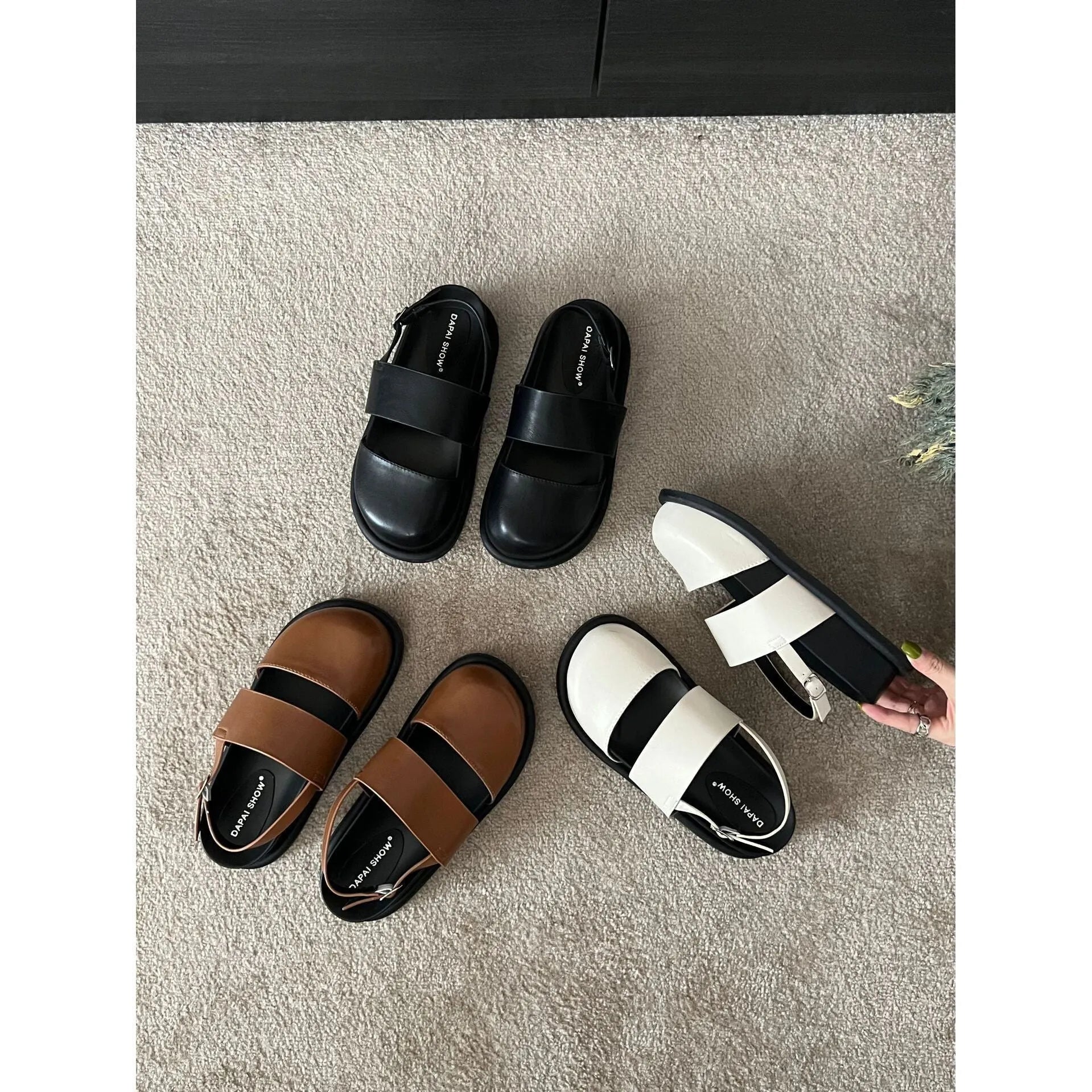 Retro raised sole sandals with ankle-strap buckle in black microfiber