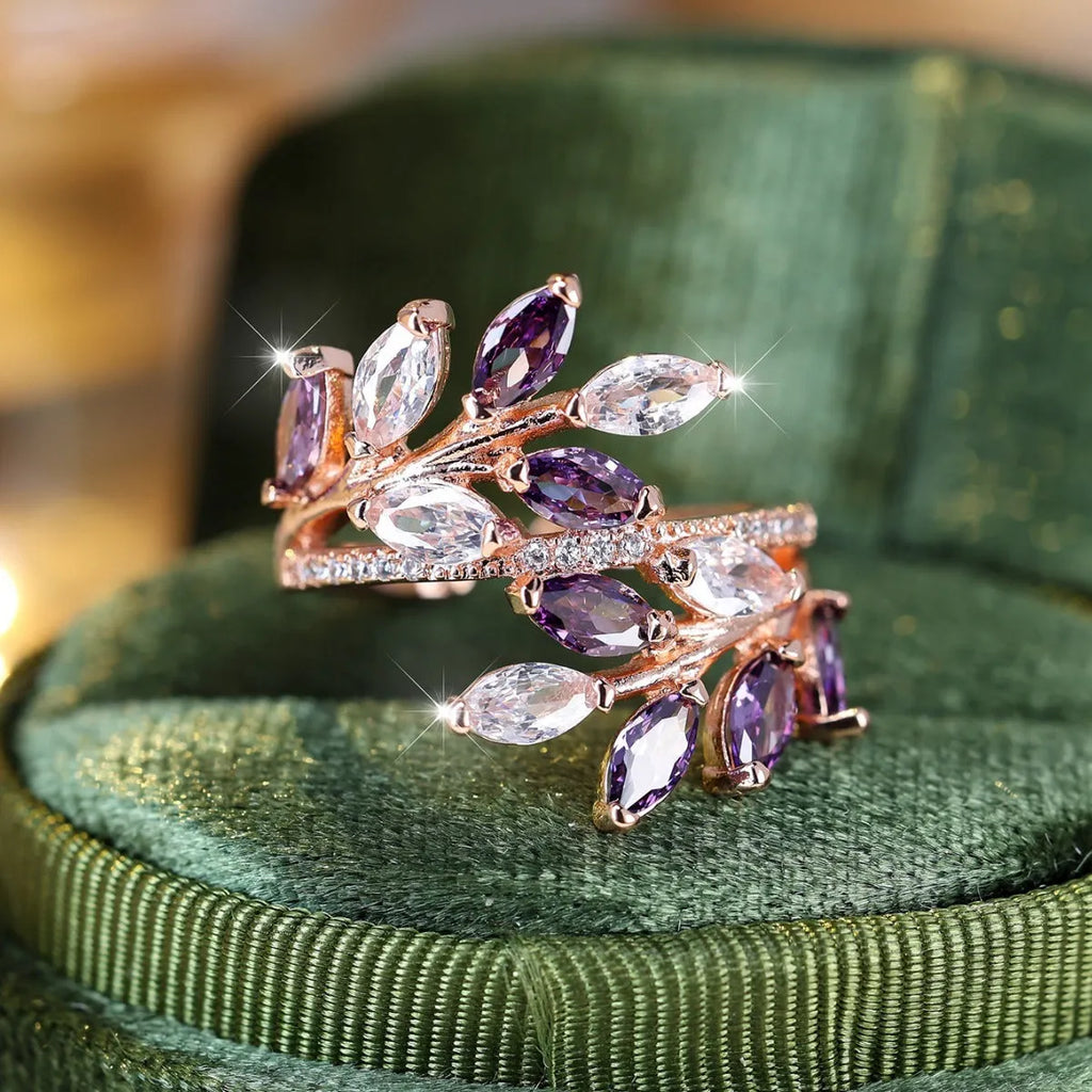 Adjustable copper leaf ring with horse eye zircon stones in multiple colour options showing botanical design