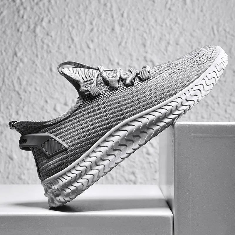 Men's summer casual shoes with flying weave upper, front tie lacing, rubber sole, available in black, coffee, grey, sizes 39-44.
