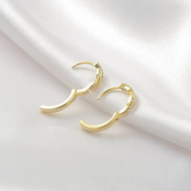 Geometric hemp rope earrings with interwoven design on copper frame, gold plating option shown