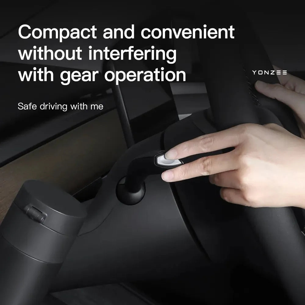 A plastic water cup holder designed for the dashboard of a left-hand drive Tesla Model 3 or Model Y.