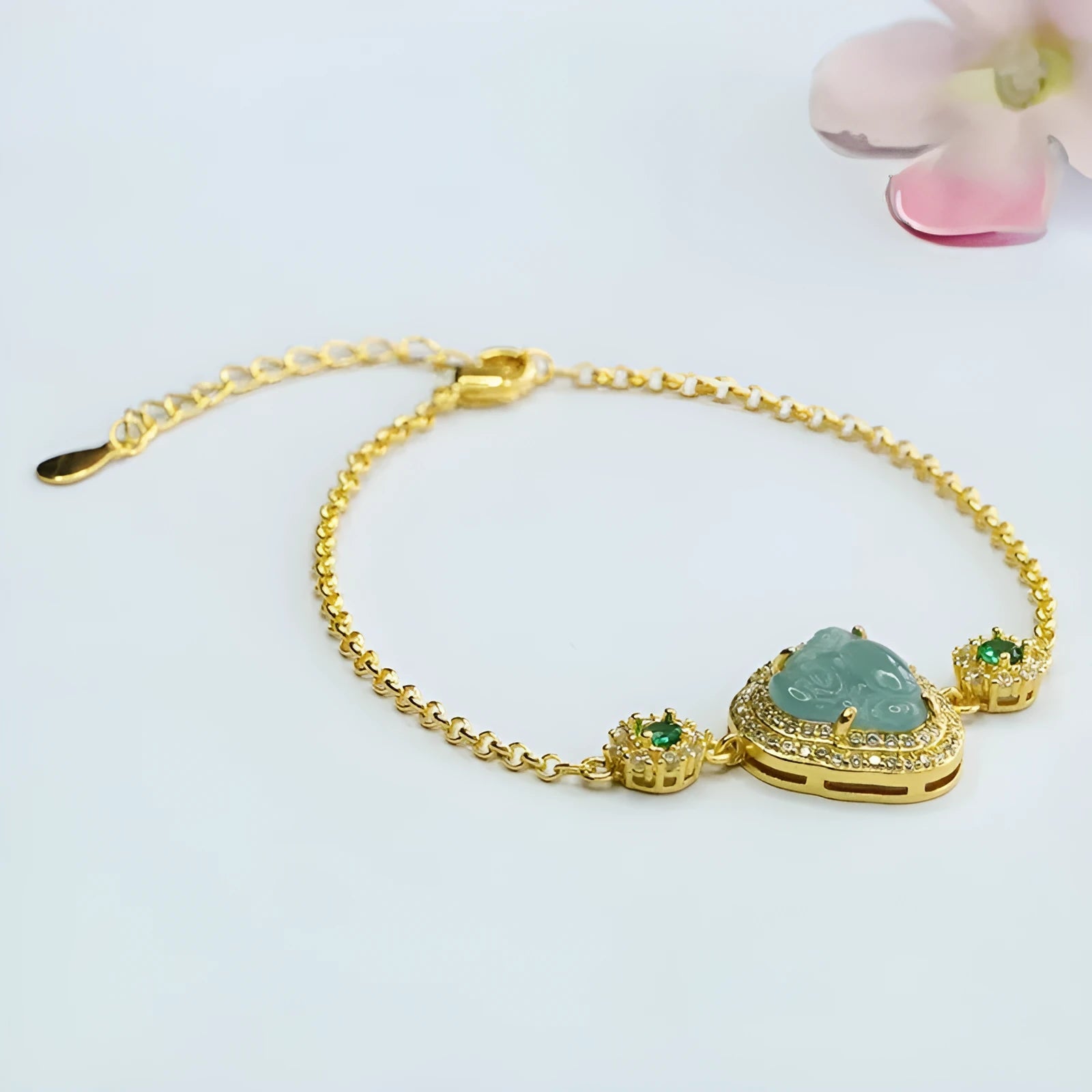 Close-up of a blue water Maitreya Buddha jade bracelet with inlaid details.