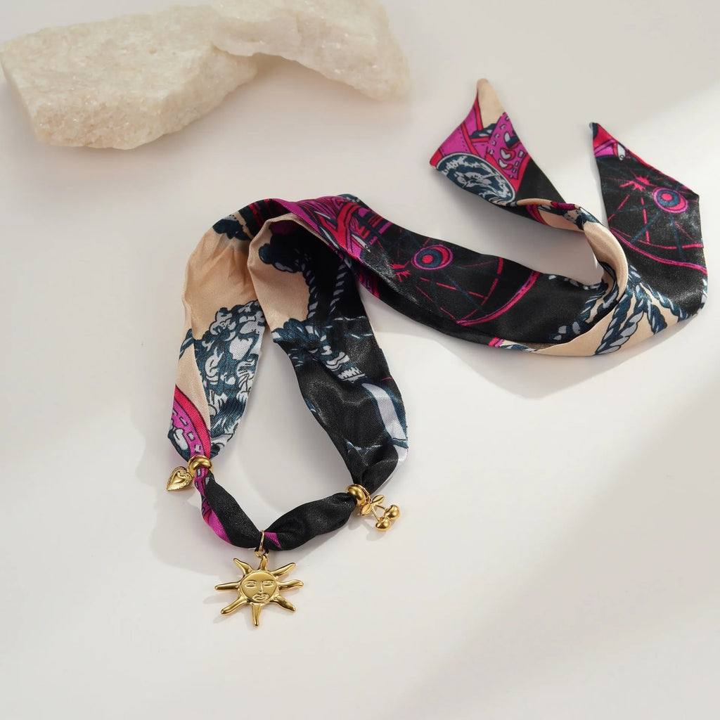 Stainless steel geometric pendant necklace and bracelet set with 18K gold-colour electroplated finish.