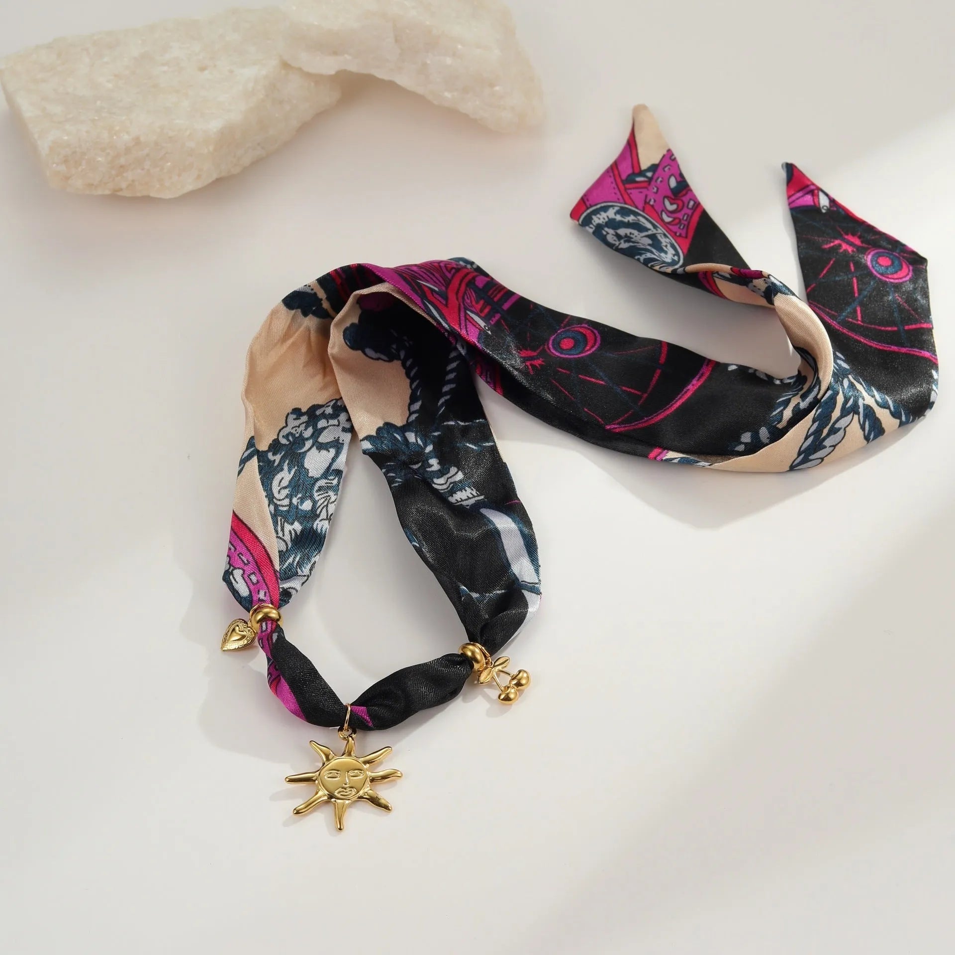Stainless steel geometric pendant necklace and bracelet set with 18K gold-colour electroplated finish.