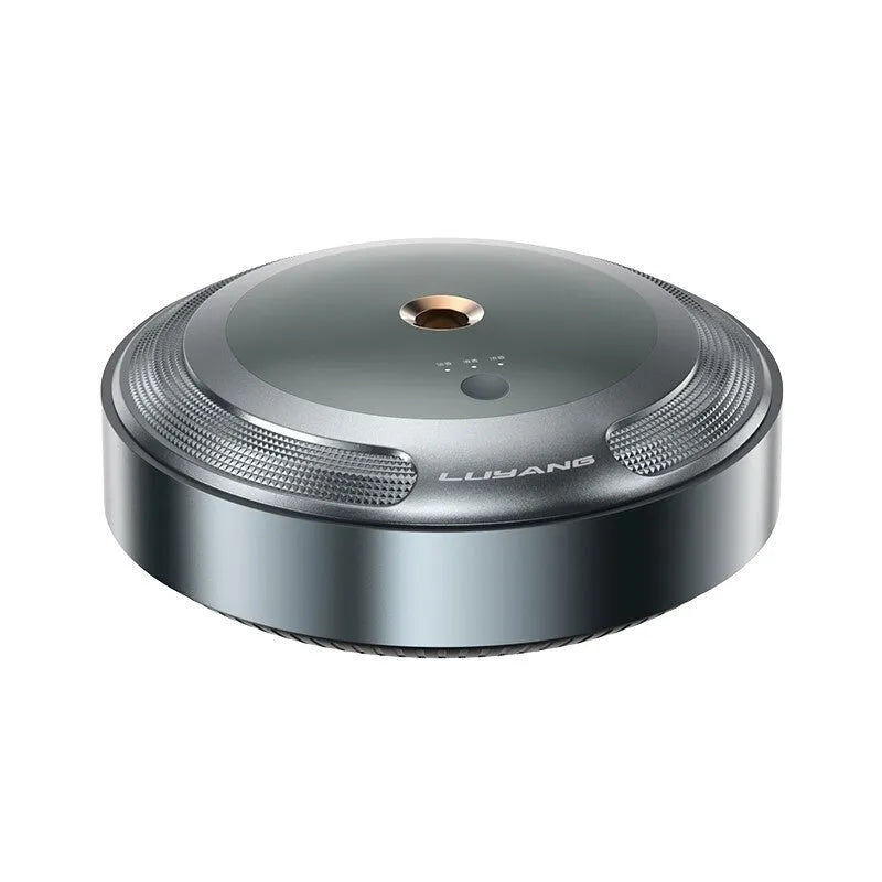 Compact automatic car air freshener machine with zinc alloy shell on a car dashboard.