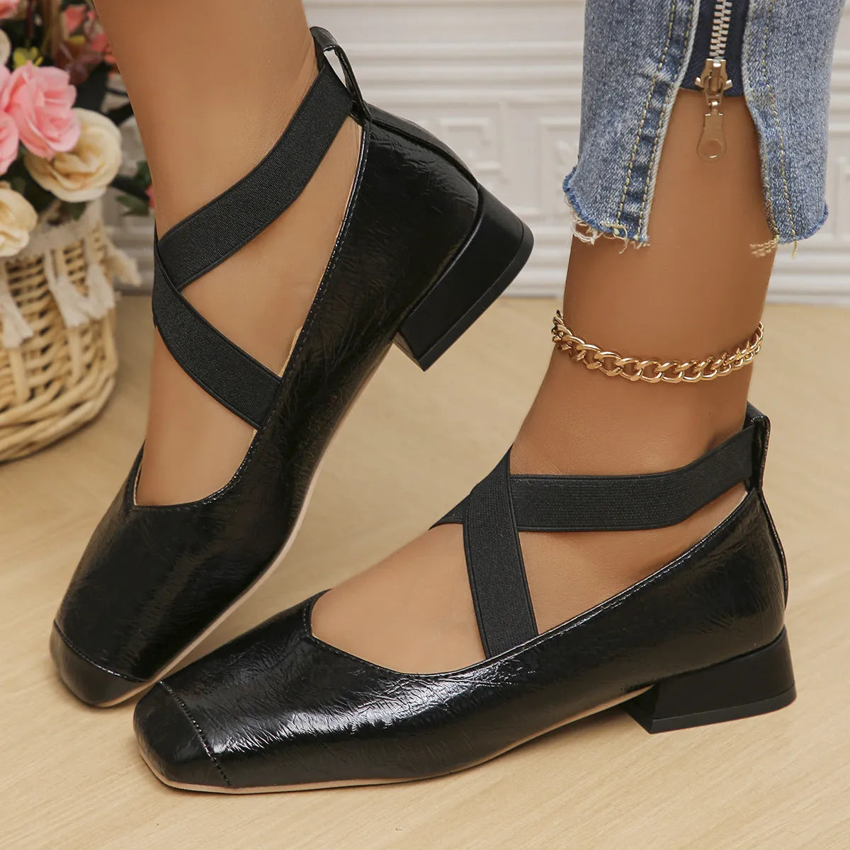 Gold slip-on evening pump with square toe and low rubber heel on a white background