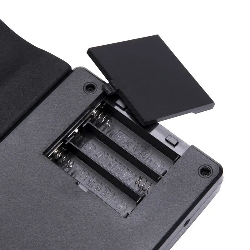 Folding electronic keyboard showing 49 silicone keys, folded to 28cm length with pearl white finish