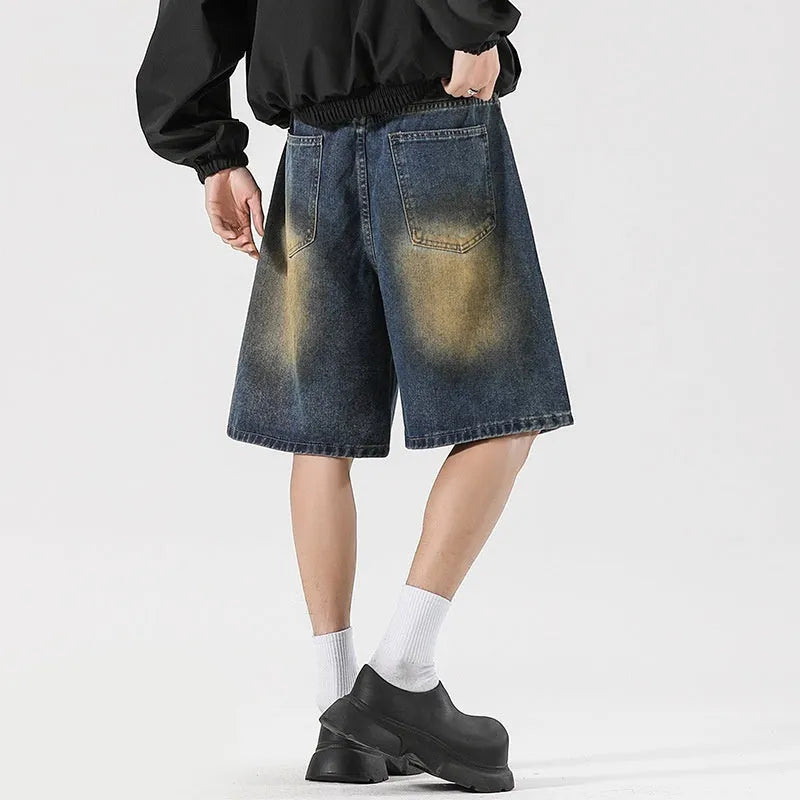 Loose fit retro blue distressed jeans on man showing cotton denim construction and street style detailing