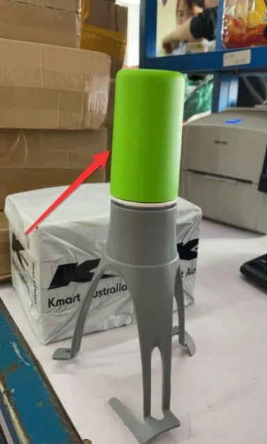 Green Uutensil Stirr automatic pot stirrer, a 22.2cm tall kitchen gadget for sauces and soups.