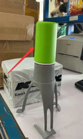 Green Uutensil Stirr automatic pot stirrer, a 22.2cm tall kitchen gadget for sauces and soups.