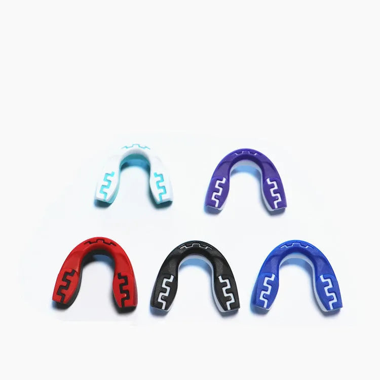 Adult boxing mouthguard with tooth socket design in black/white colour variant showing printed teeth pattern
