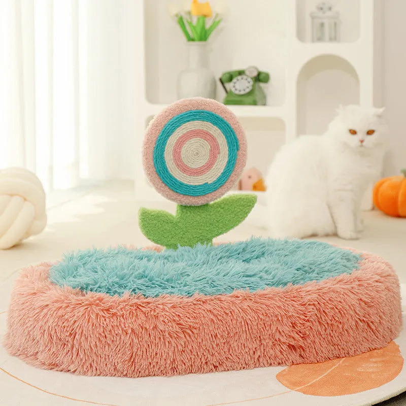 Pink elliptical lollipop shaped plush cat bed with raised sides, showing a removable cover.
