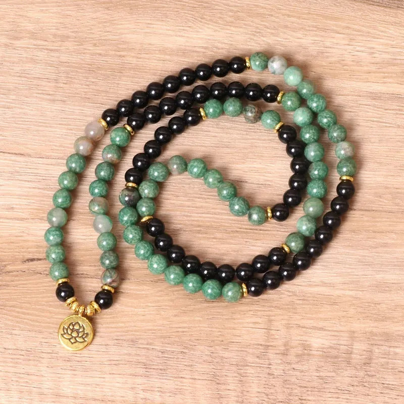 Green and black elastic beaded long bracelet with alloy material and adjustable sizing