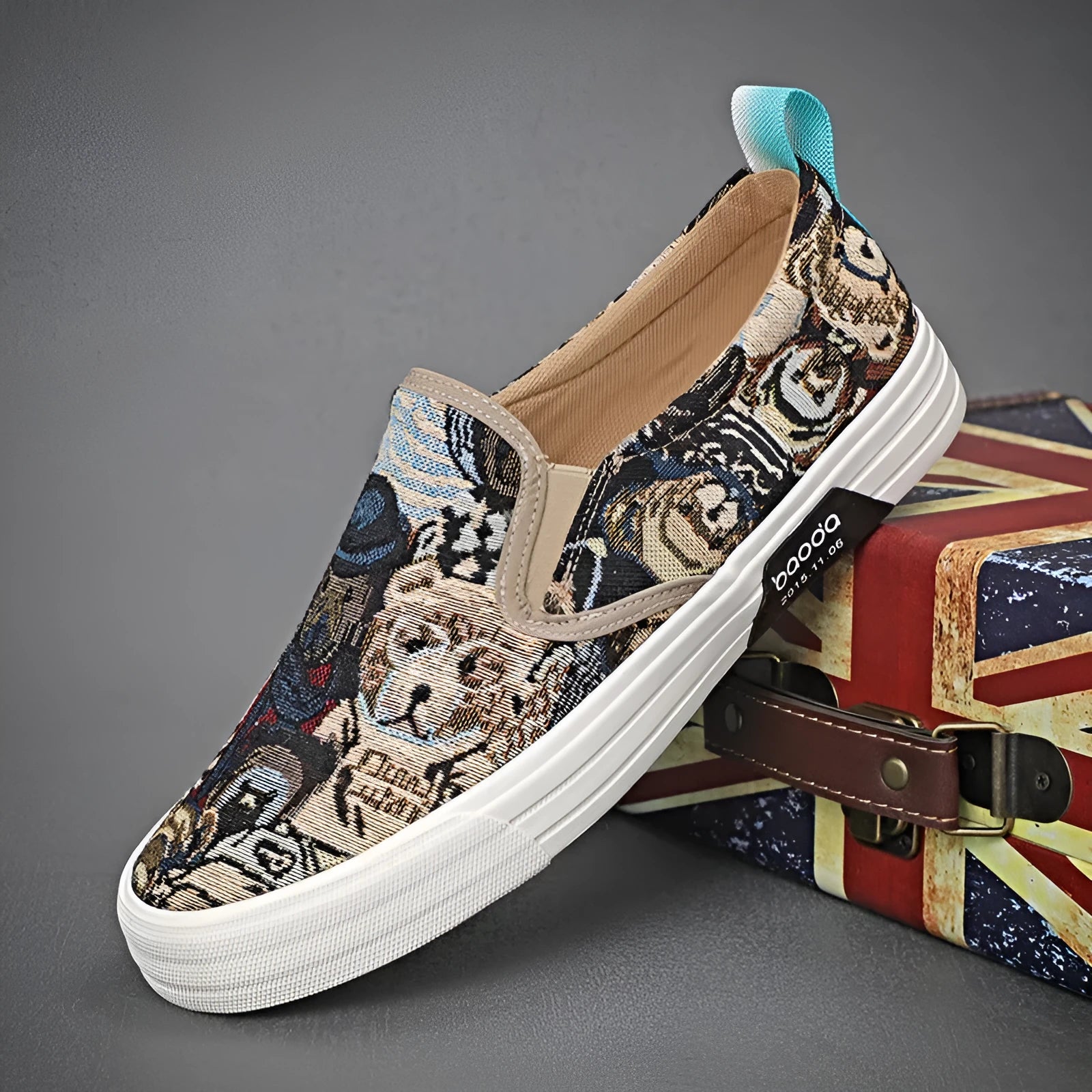 A pair of khaki-coloured canvas slip-on sneakers with a low-top profile, round toe, and vulcanised rubber sole on a plain background.