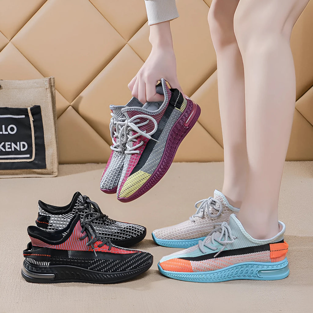 Women's low-top running shoes in purple, featuring a rounded toe and front lace-up design.